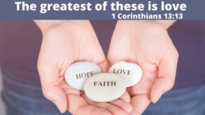 3 rocks held in cupped hands, on the rocks are written: Faith, Hope, Love